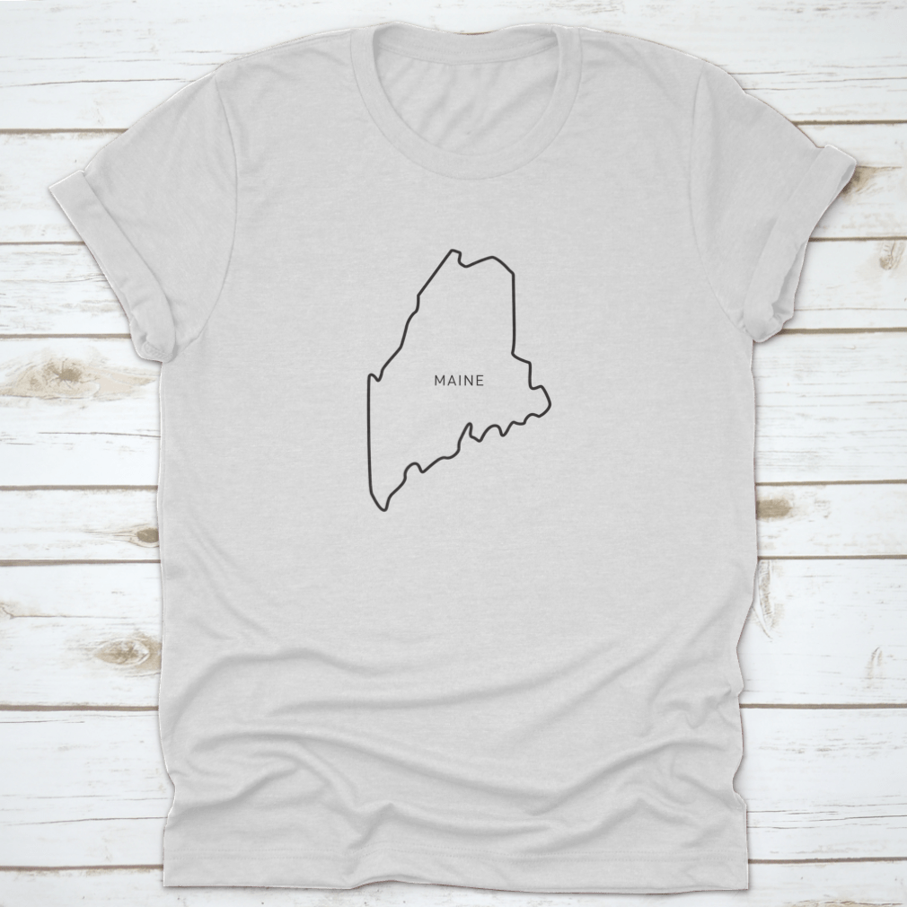 A stylish t-shirt featuring a simple typography outline of the state of Maine, made from high-quality cotton fabric.